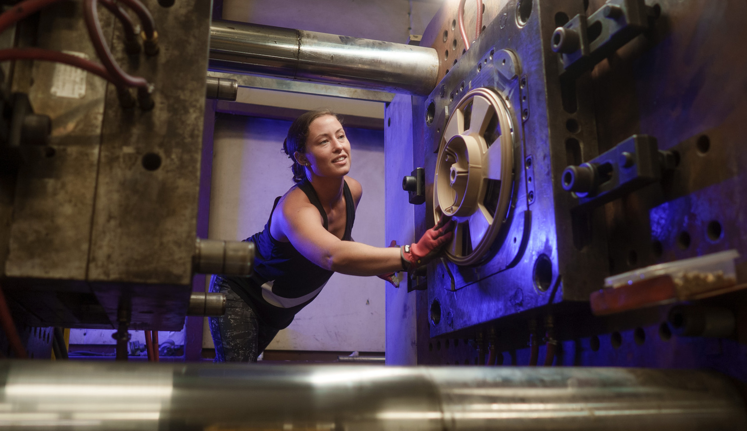 woman working at a piece of machinery